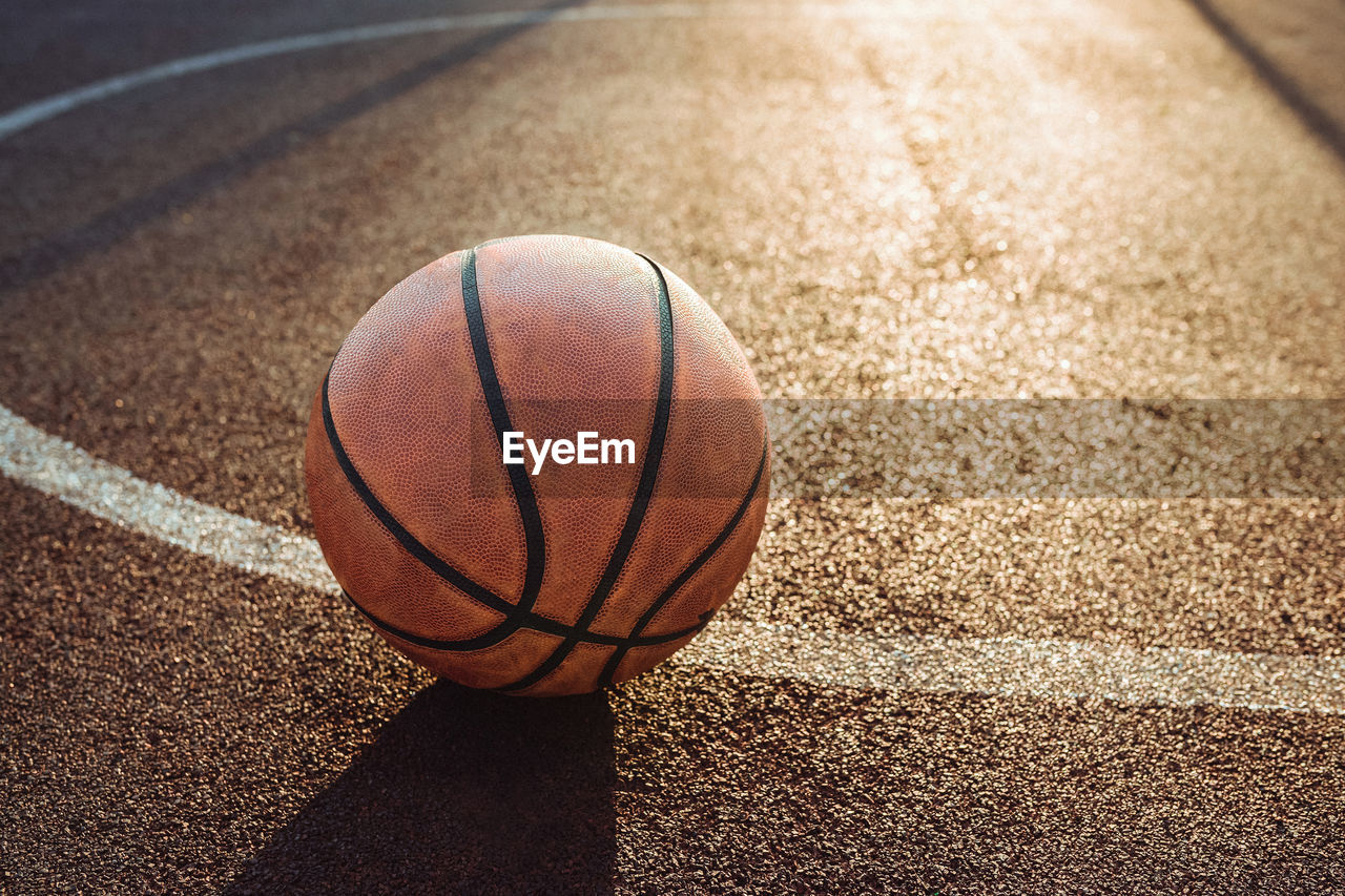 Basketball ball on urban court. sport, recreation concept.