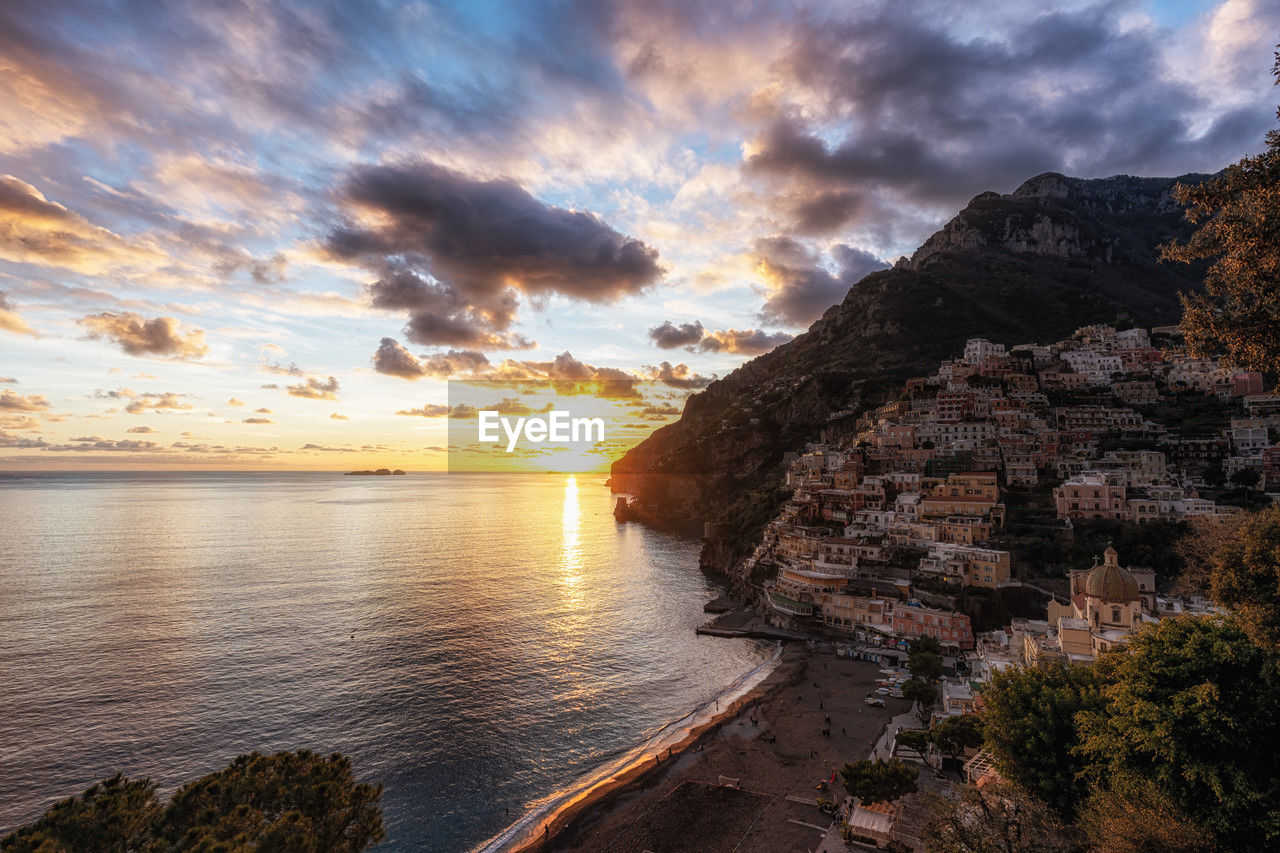sky, water, cloud, sunset, sea, scenics - nature, coast, beauty in nature, nature, land, beach, environment, landscape, travel destinations, shore, dramatic sky, dusk, travel, evening, rock, tranquility, mountain, ocean, seascape, no people, sun, outdoors, tranquil scene, coastline, horizon, reflection, sunlight, bay, tourism, cloudscape, cliff, architecture, idyllic, holiday, vacation, trip, horizon over water, body of water