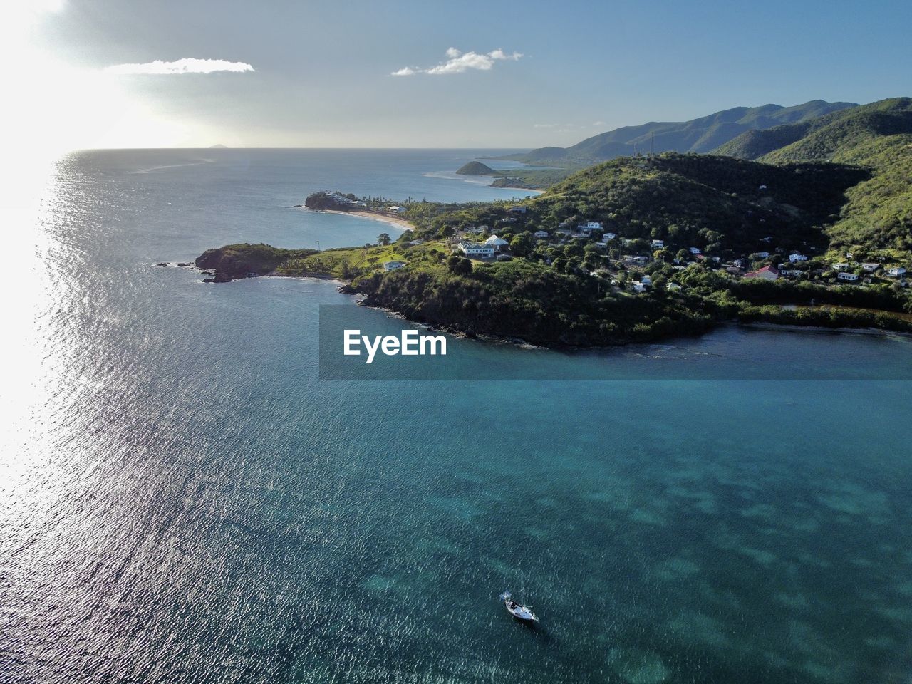 water, sea, land, scenics - nature, nature, sky, coast, beauty in nature, beach, travel destinations, travel, ocean, island, coastline, tranquility, environment, blue, nautical vessel, vacation, aerial view, holiday, landscape, high angle view, trip, tranquil scene, transportation, day, outdoors, tourism, archipelago, bay, terrain, idyllic, mountain, tropical climate, body of water, no people, islet, shore, seascape, tree, cloud, sunlight, turquoise colored, bay of water, lagoon, rock, summer, sports, cliff, plant, non-urban scene, mode of transportation