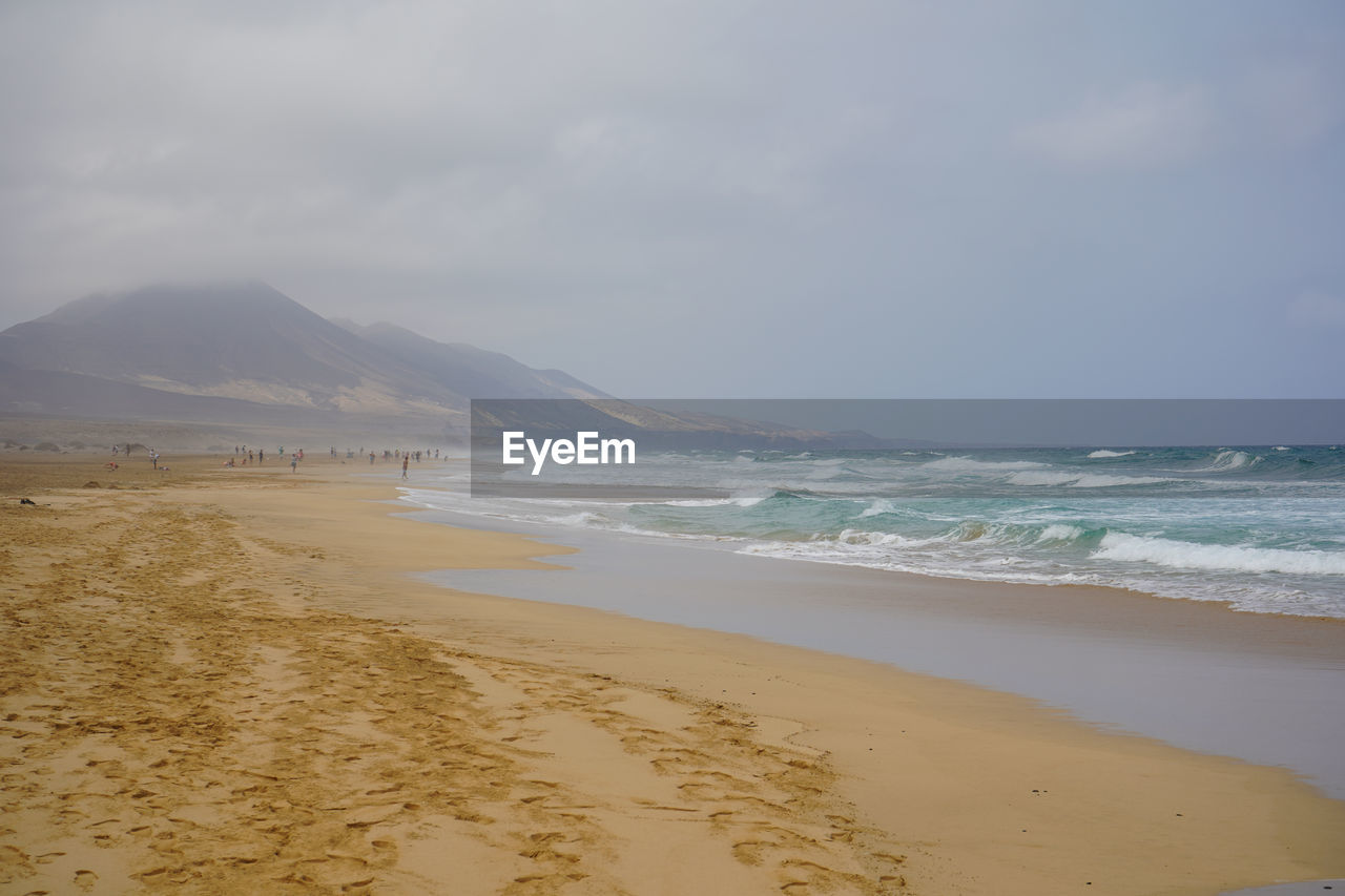 Scenic view of beach against sky