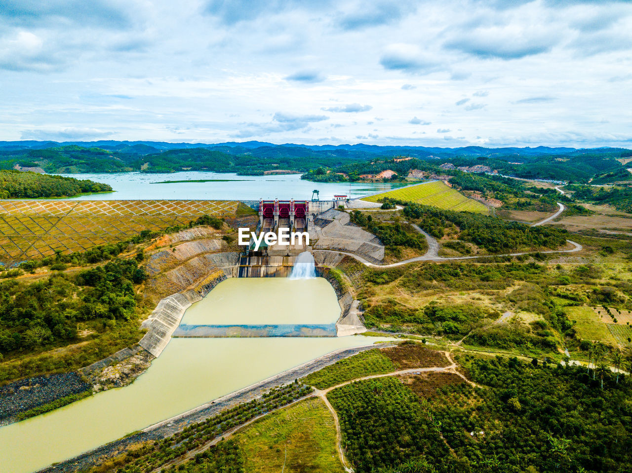 Scenic view of landscape against cloudy sky
