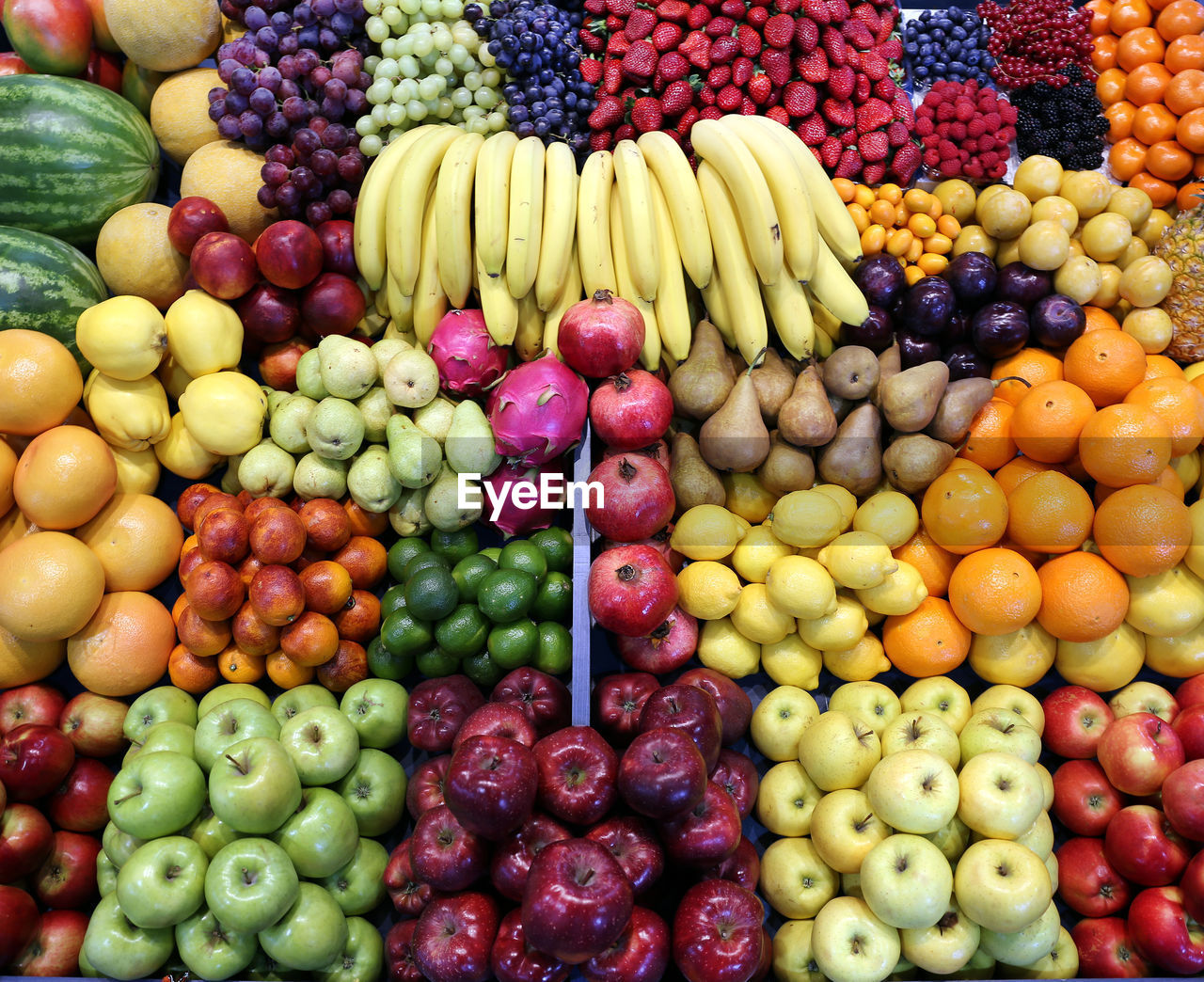 VARIOUS FRUITS IN MARKET STALL AT SALE
