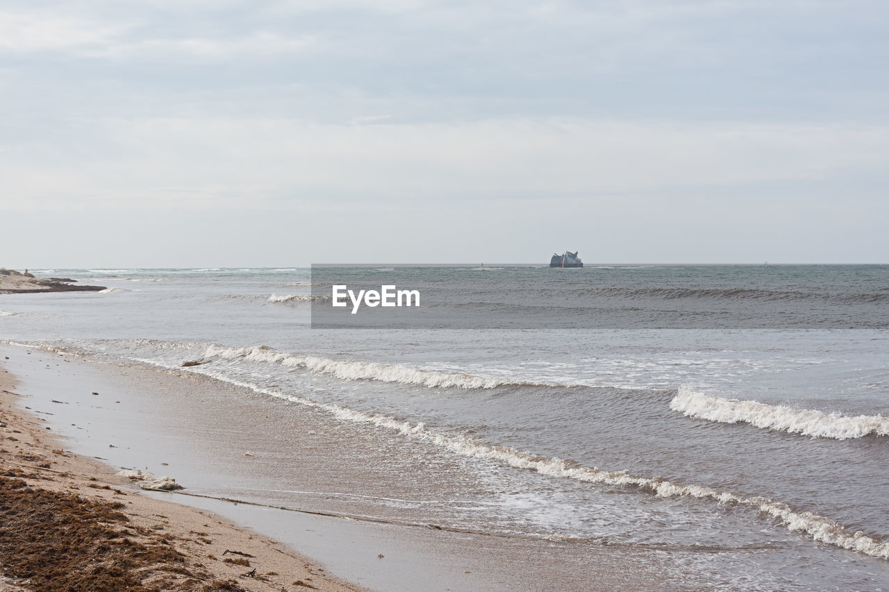 Storm sea sand beach is a neutral color. natural background in beige shades. 