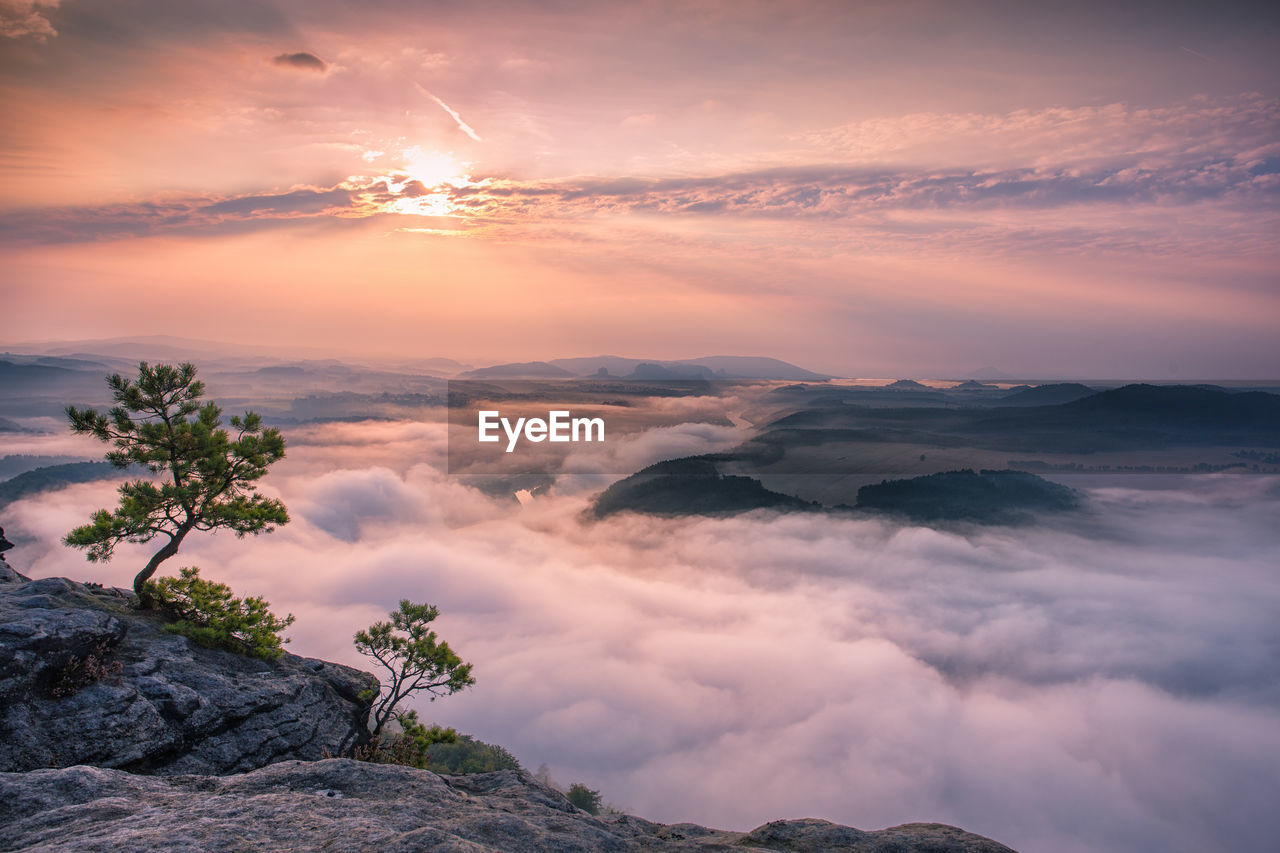 Scenic view of mountains against cloudy sky