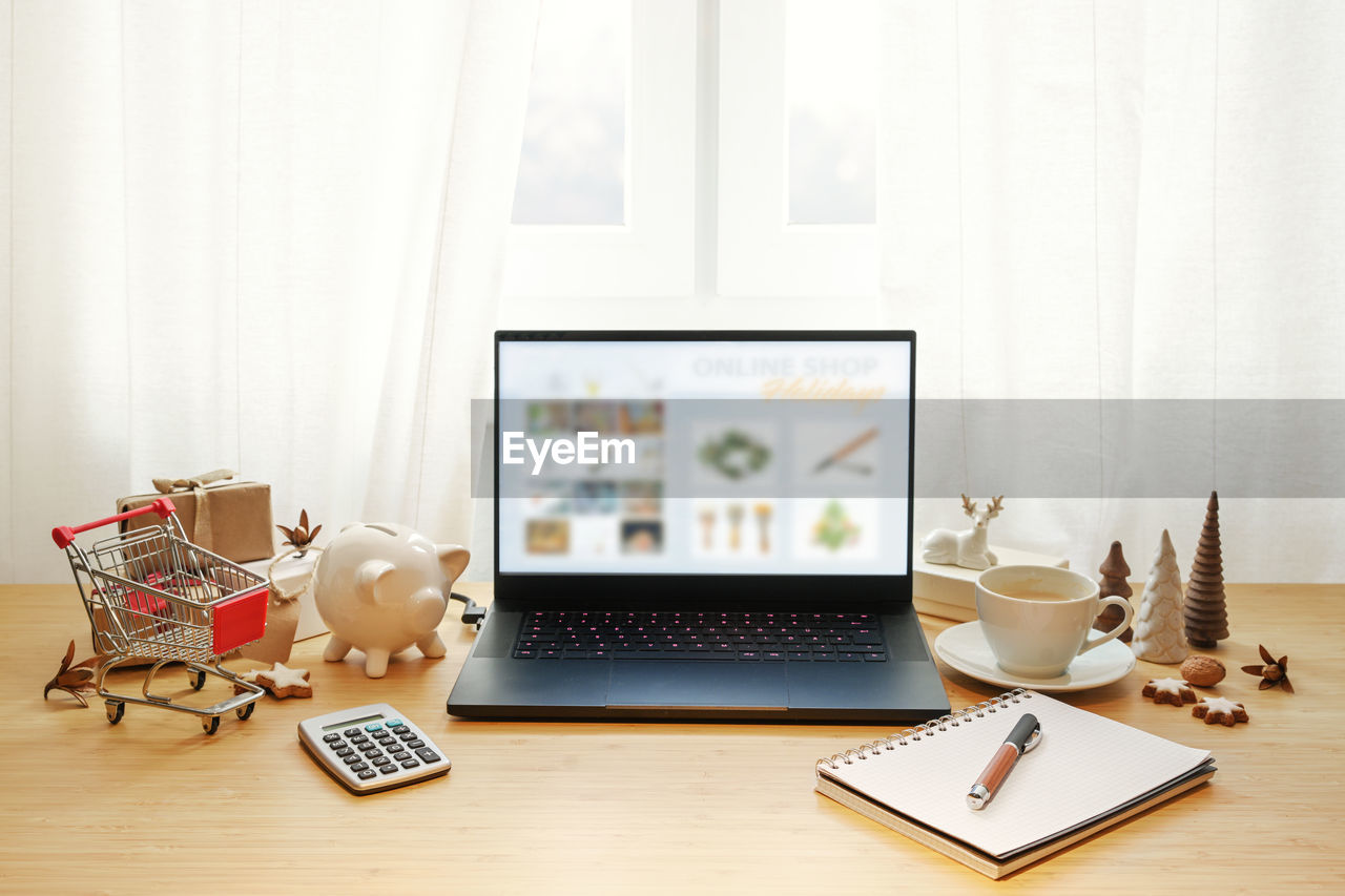 close-up of laptop and books on table