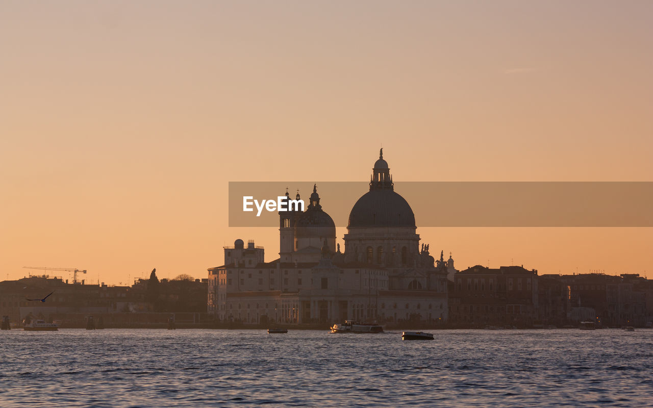 Grand canal against santa maria della salute during sunset