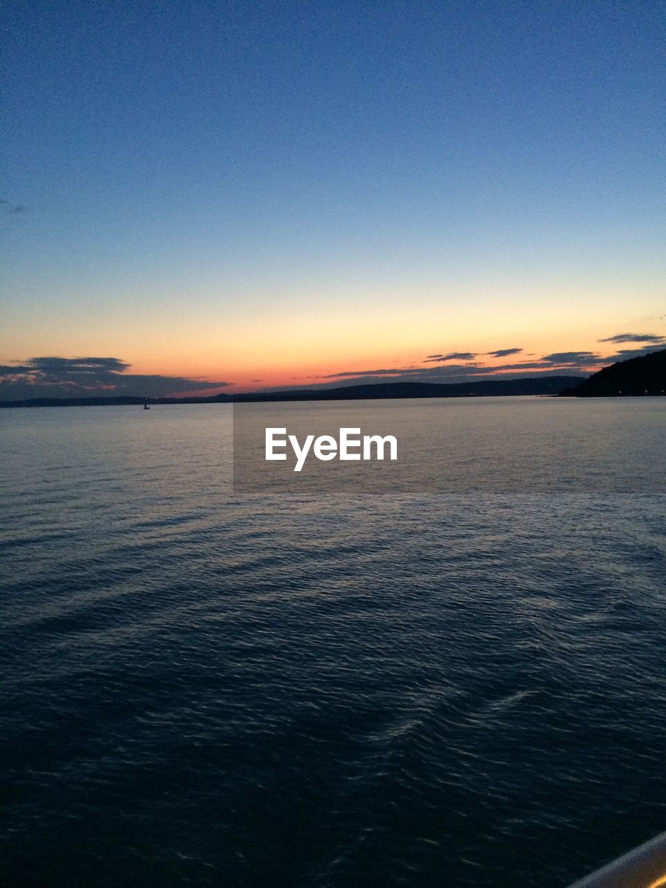 Scenic view of lake balaton against sunset sky