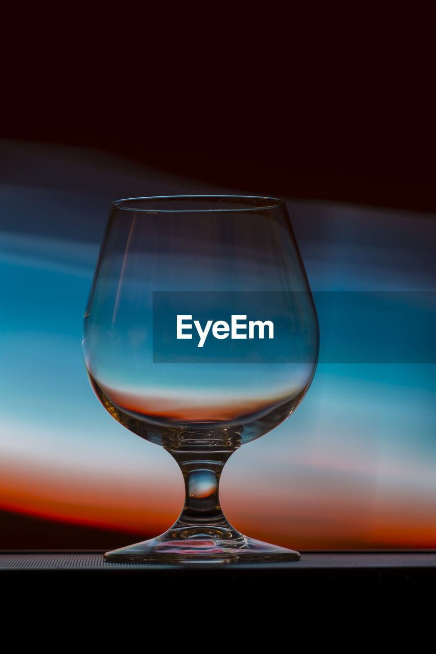 Empty wineglass on table