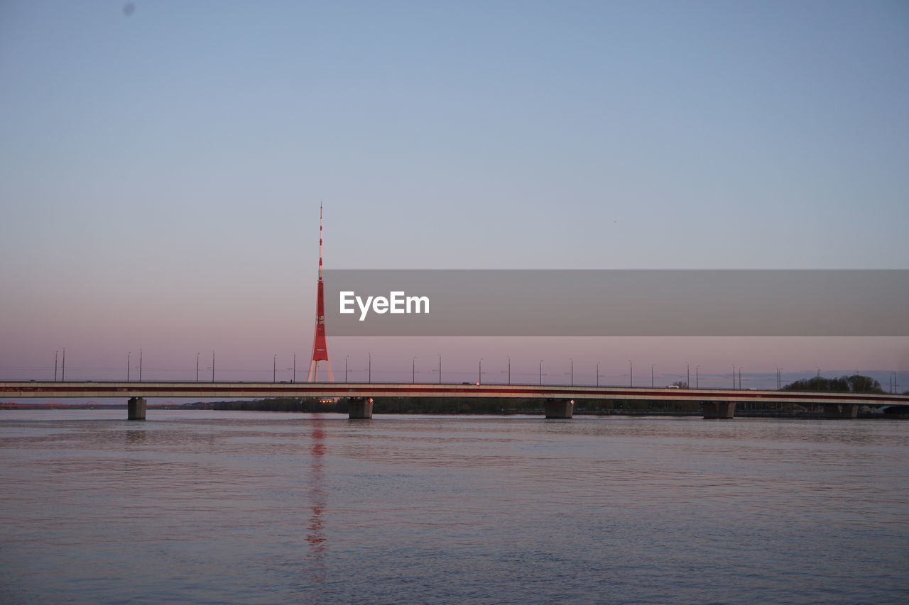 VIEW OF SUSPENSION BRIDGE AT DUSK