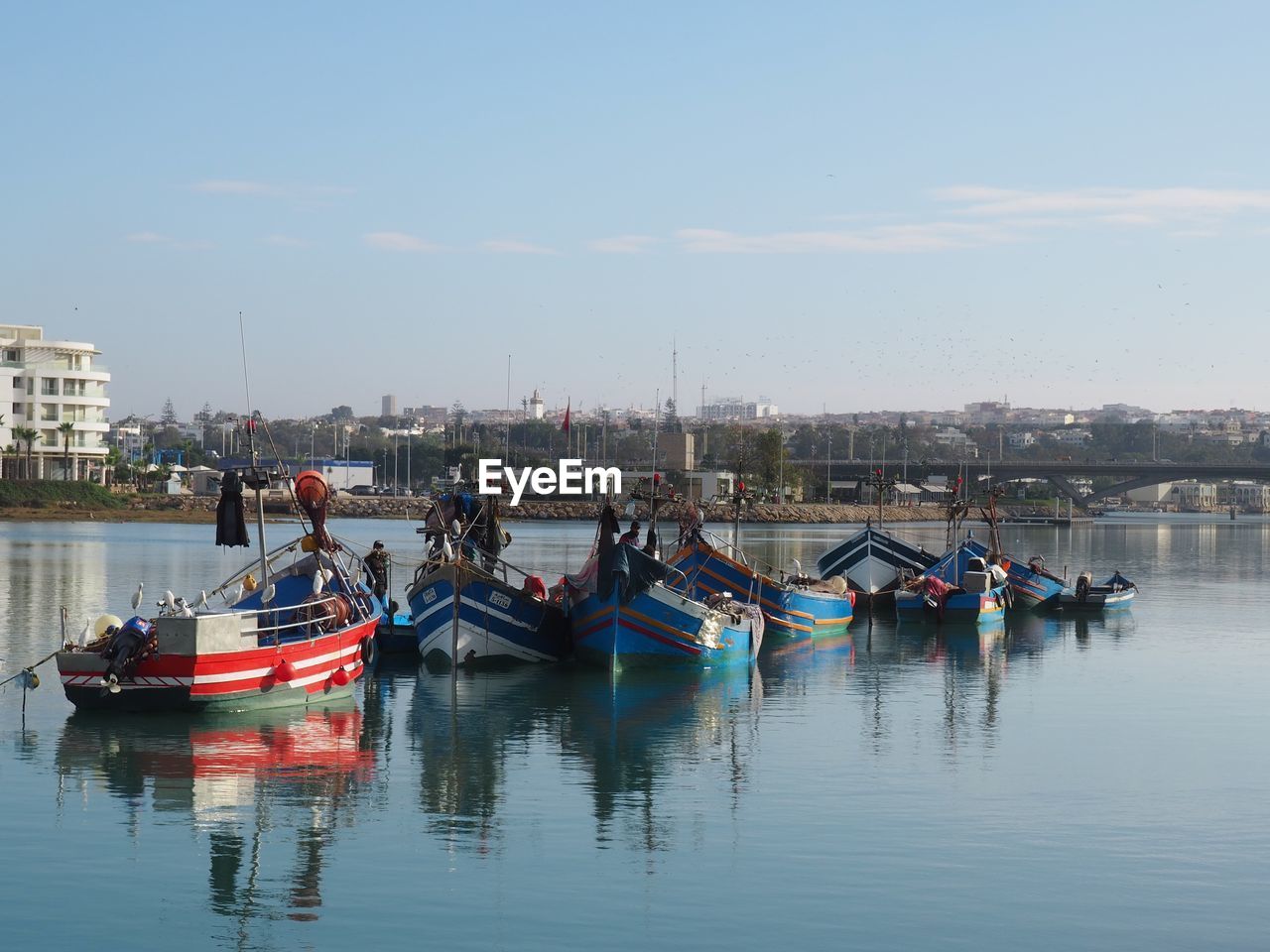 water, nautical vessel, transportation, mode of transportation, sky, boat, vehicle, architecture, boating, sea, nature, reflection, waterfront, building exterior, harbor, built structure, moored, city, day, ship, travel, travel destinations, watercraft, outdoors, no people, waterway, building, bay