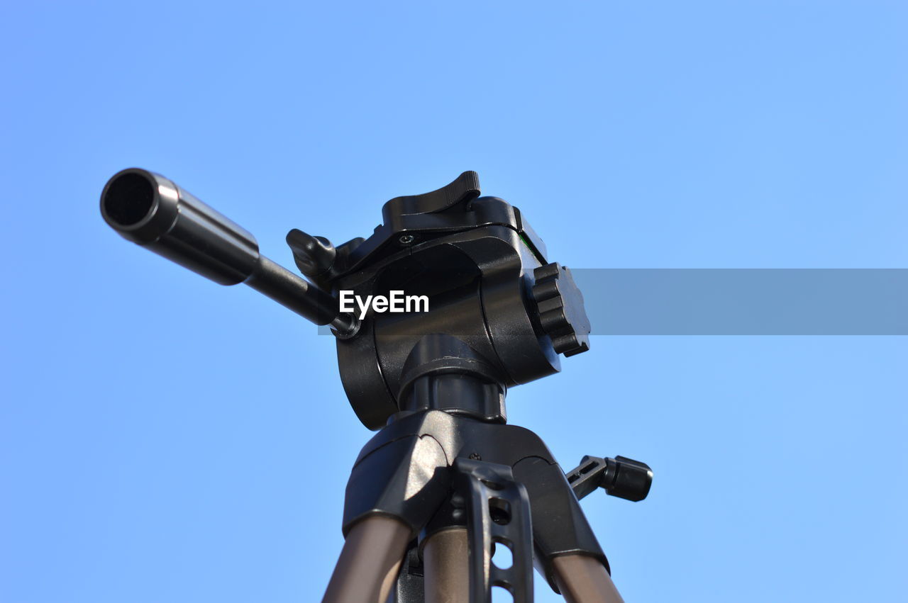 A tripod in the blue sky