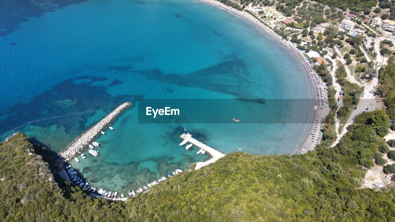 HIGH ANGLE VIEW OF POOL BY SEA