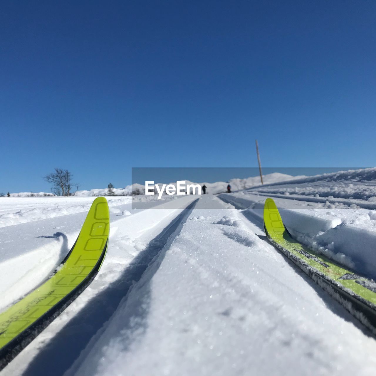 SNOW COVERED LANDSCAPE AGAINST CLEAR SKY