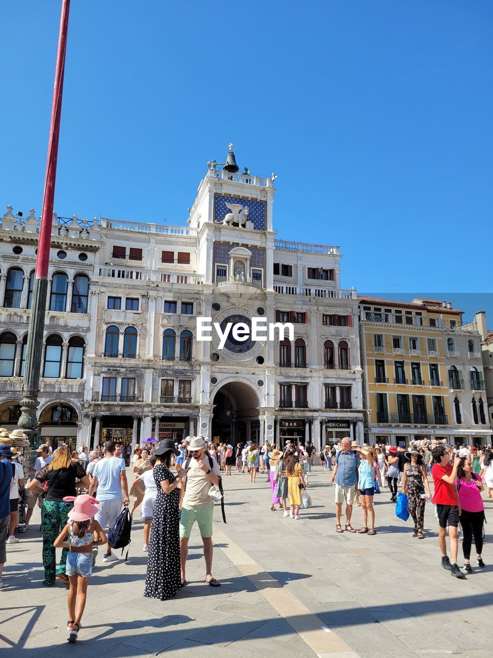 architecture, built structure, building exterior, sky, clear sky, nature, day, city, low angle view, building, tower block, sunny, skyscraper, blue, outdoors, sunlight, group of people, tower, construction industry, industry, travel