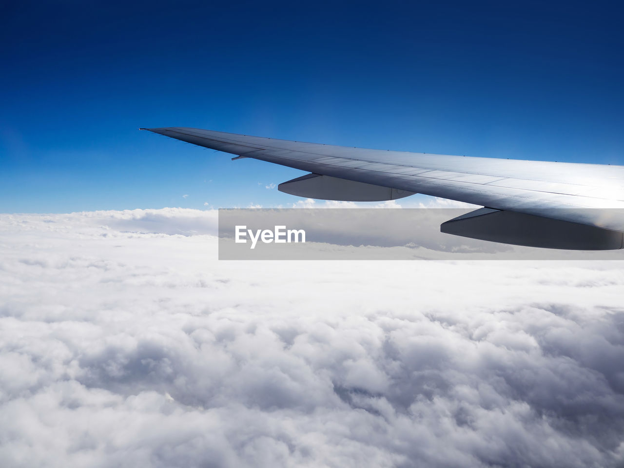 AERIAL VIEW OF CLOUDSCAPE OVER AIRPLANE