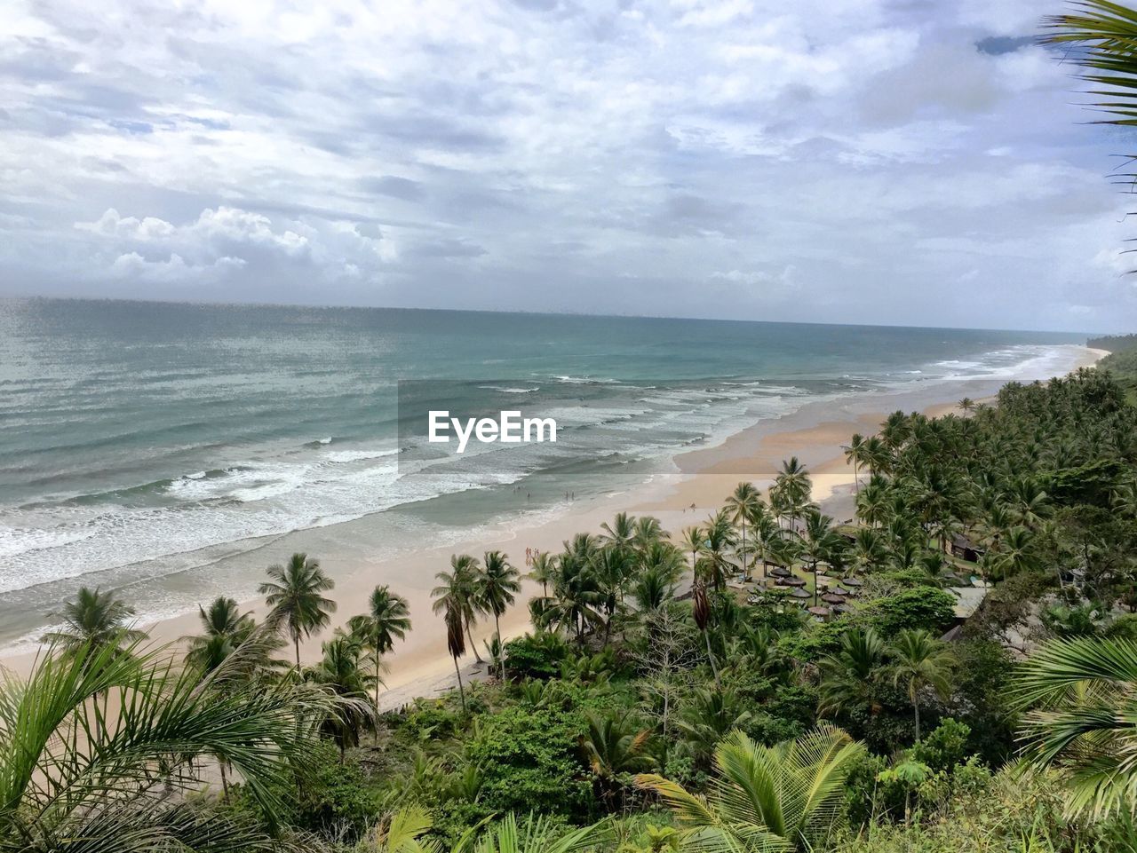 Scenic view of sea against cloudy sky