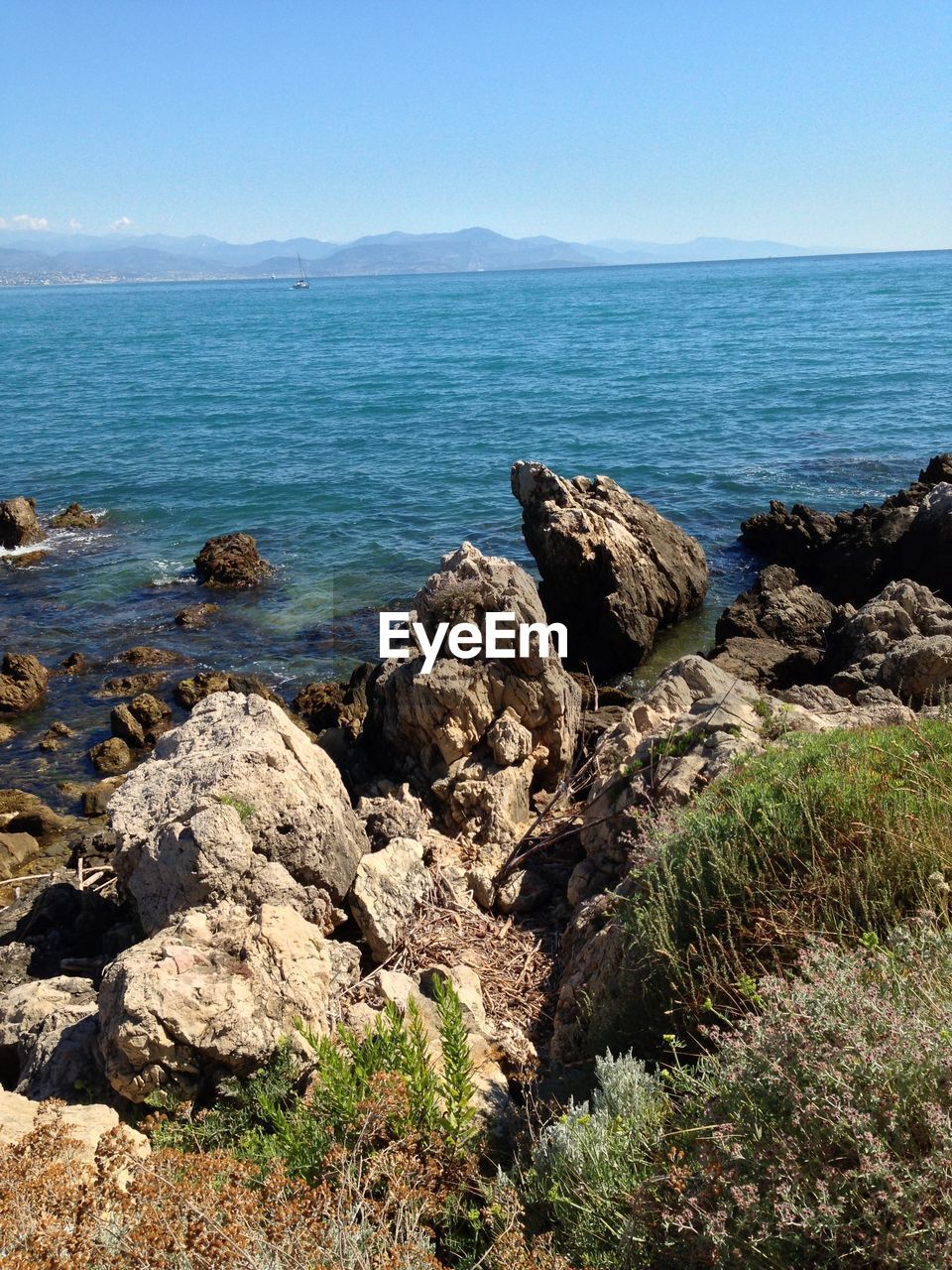 Scenic view of sea against clear sky