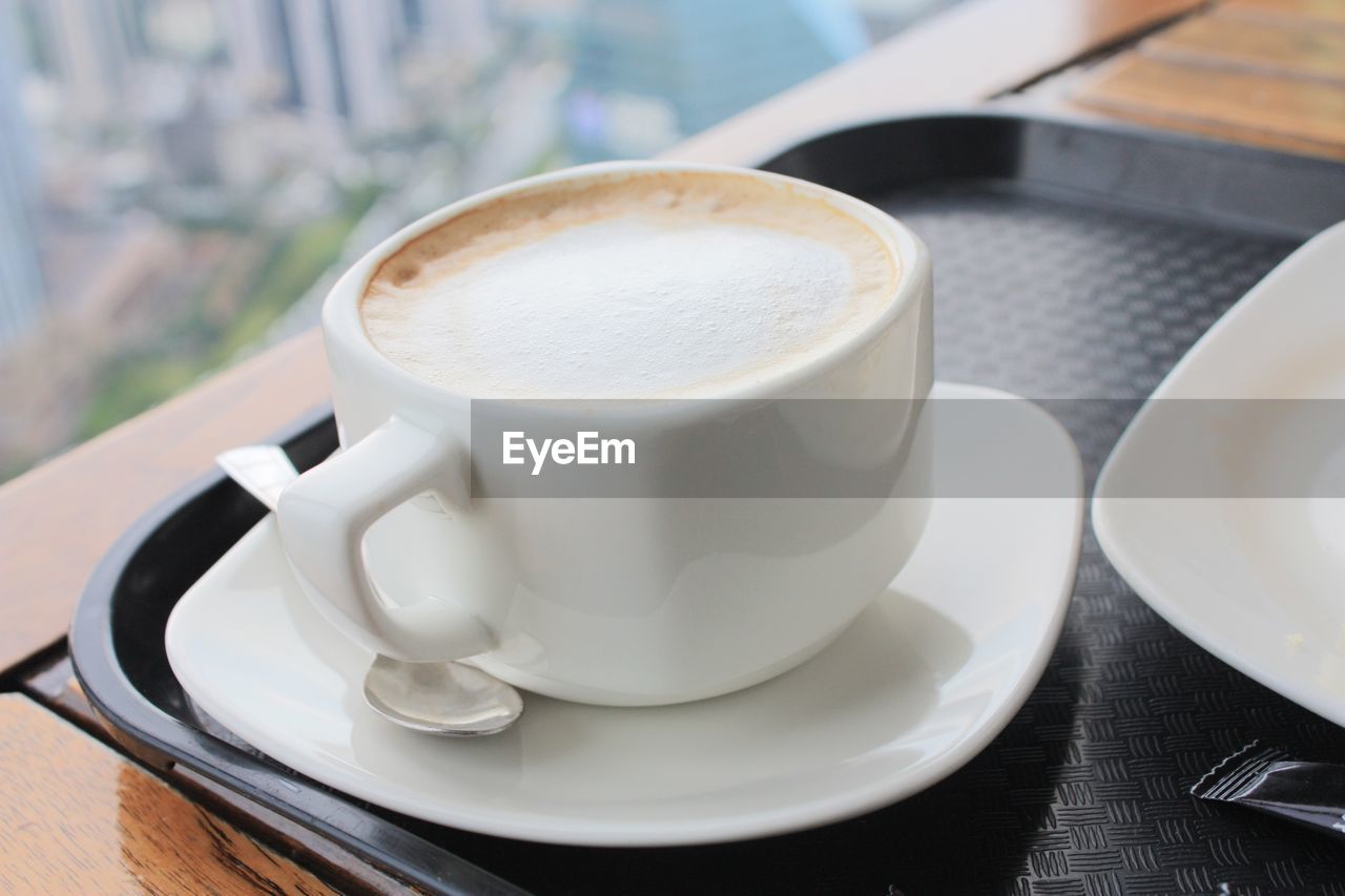 Close-up of cappuccino on table