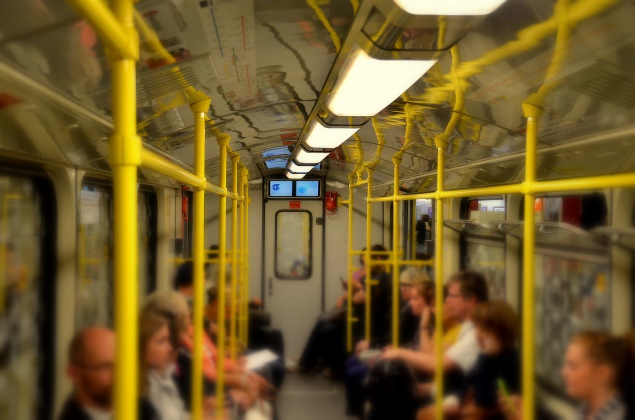 People traveling in illuminated train