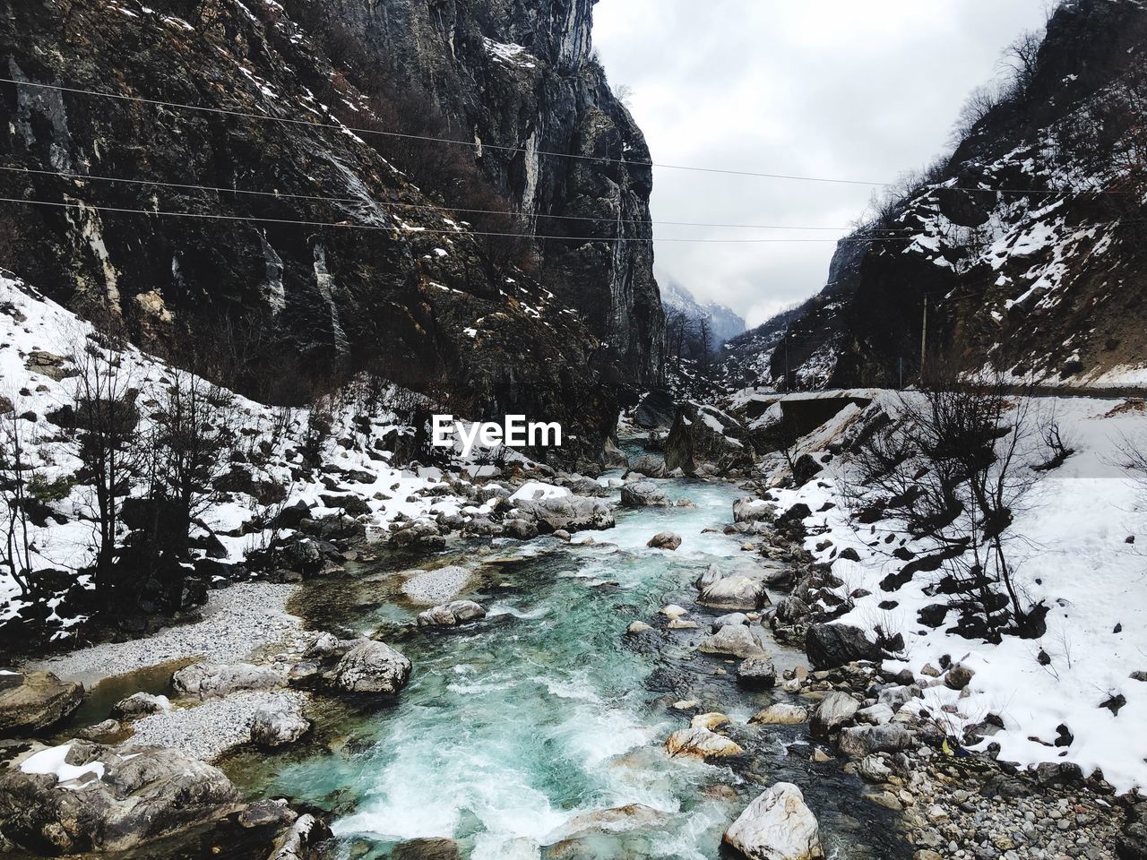 VIEW OF STREAM FLOWING THROUGH ROCKS