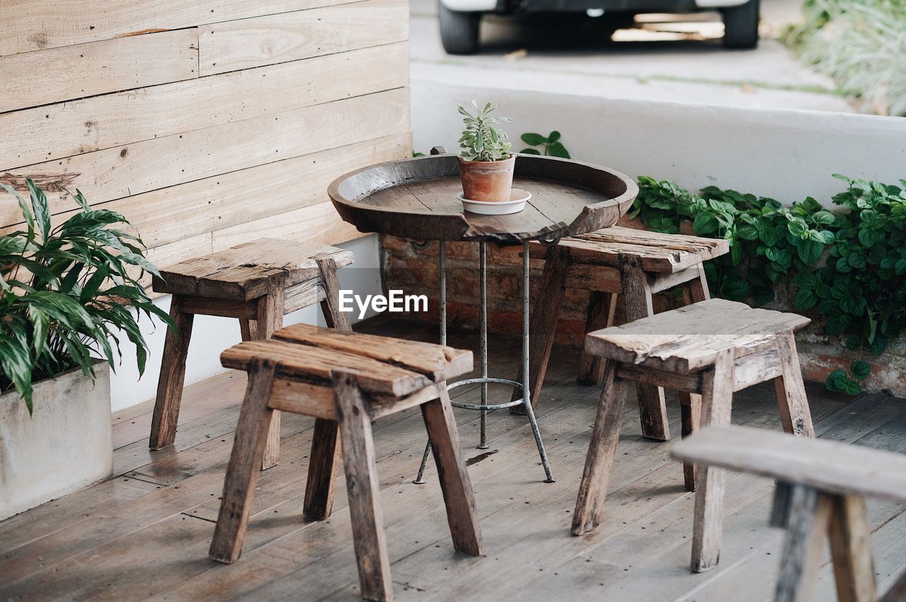 Empty wooden stools on porch