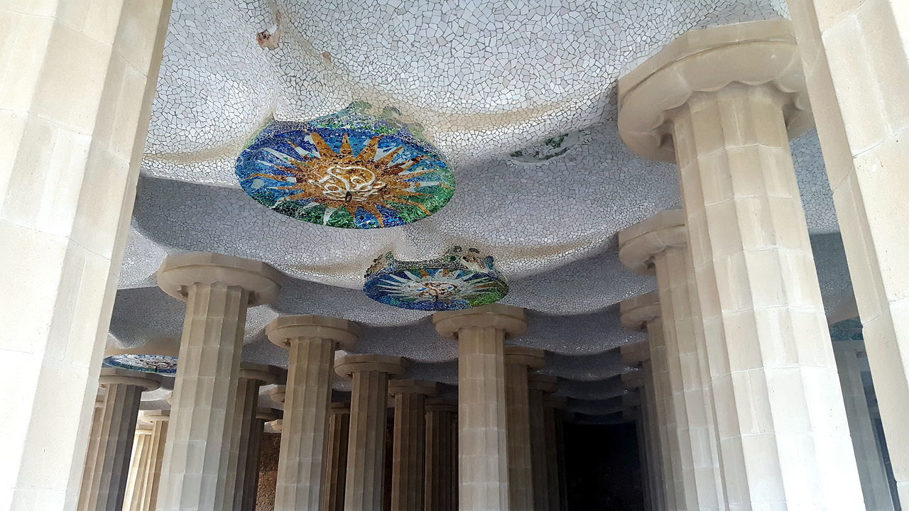 LOW ANGLE VIEW OF ORNATE BUILDING ON CEILING OF OLD CHURCH