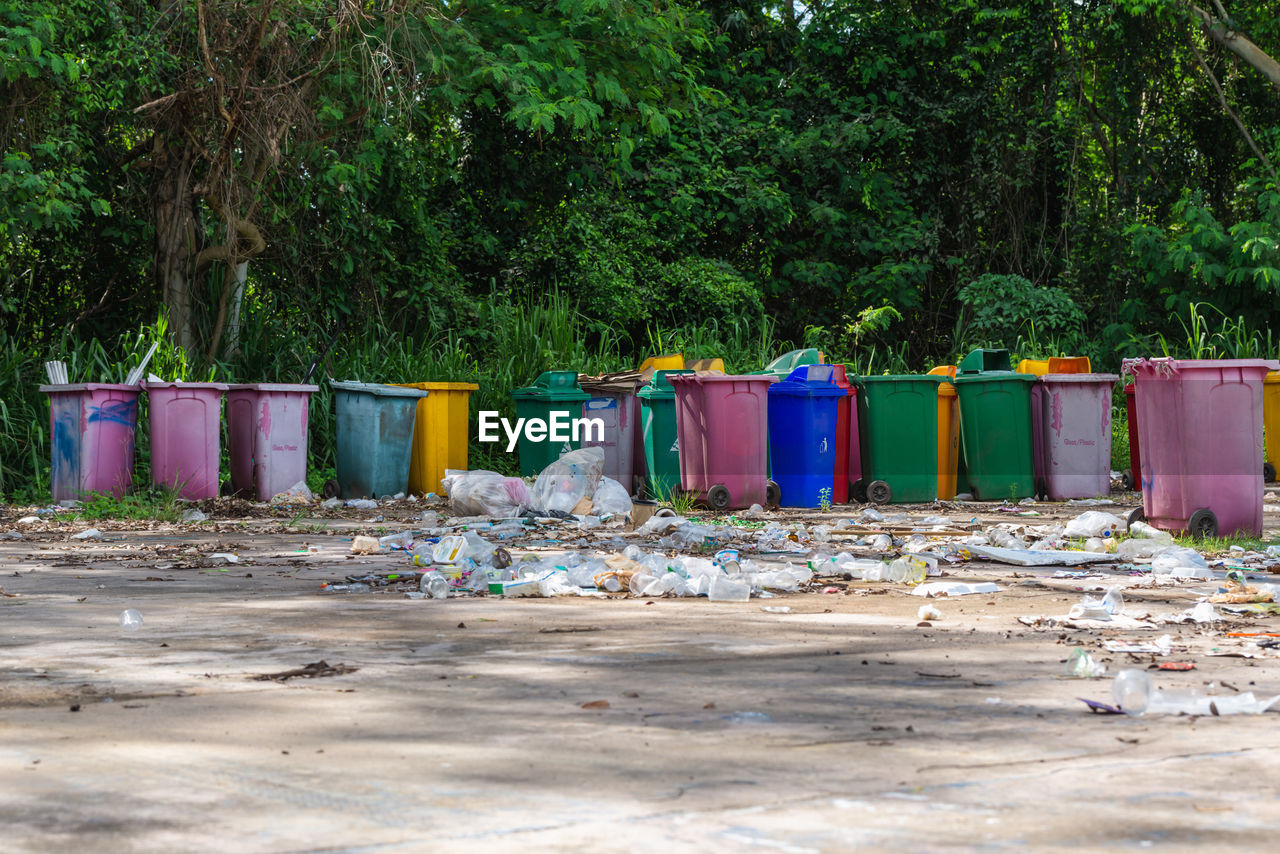 Plastic bins were left in the garbage collection area. pollute