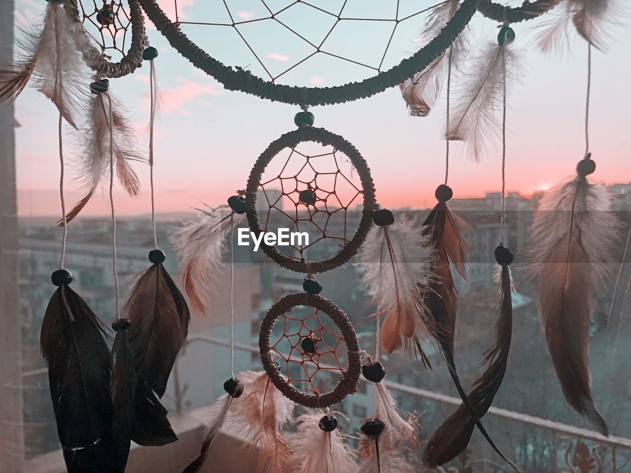 Close-up of dreamcatcher hanging at home