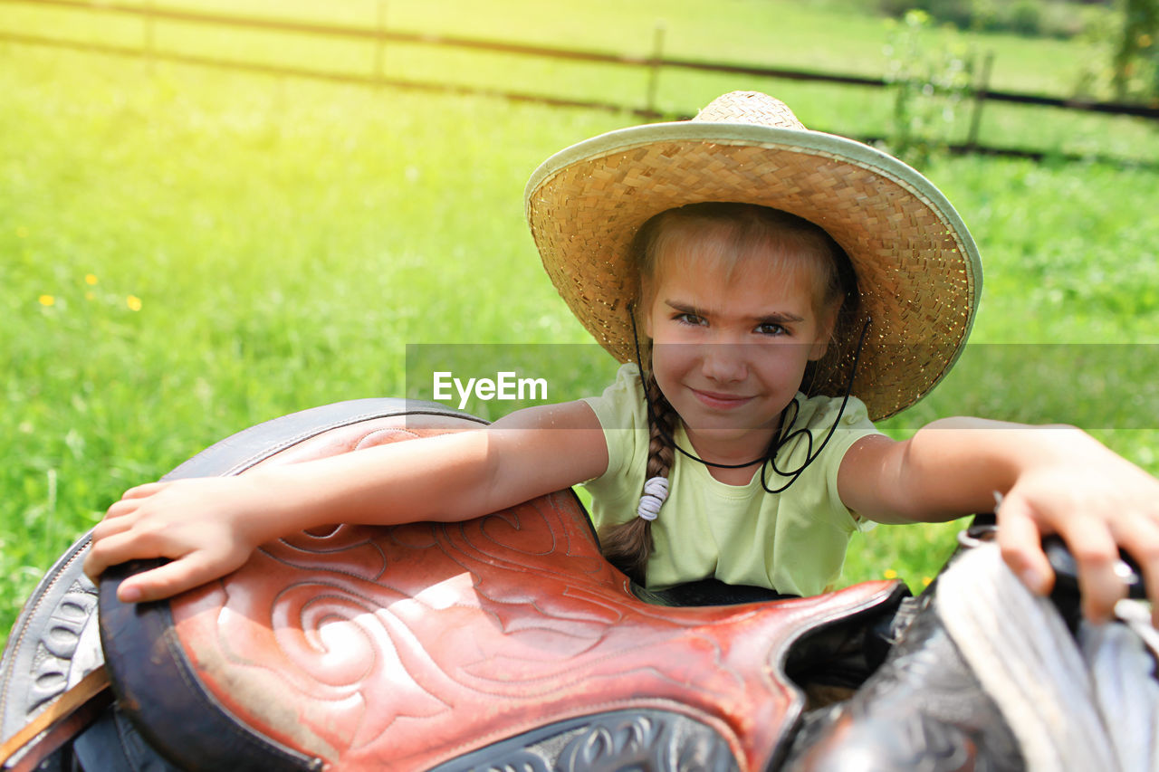 Portrait of smiling girl wearing hat