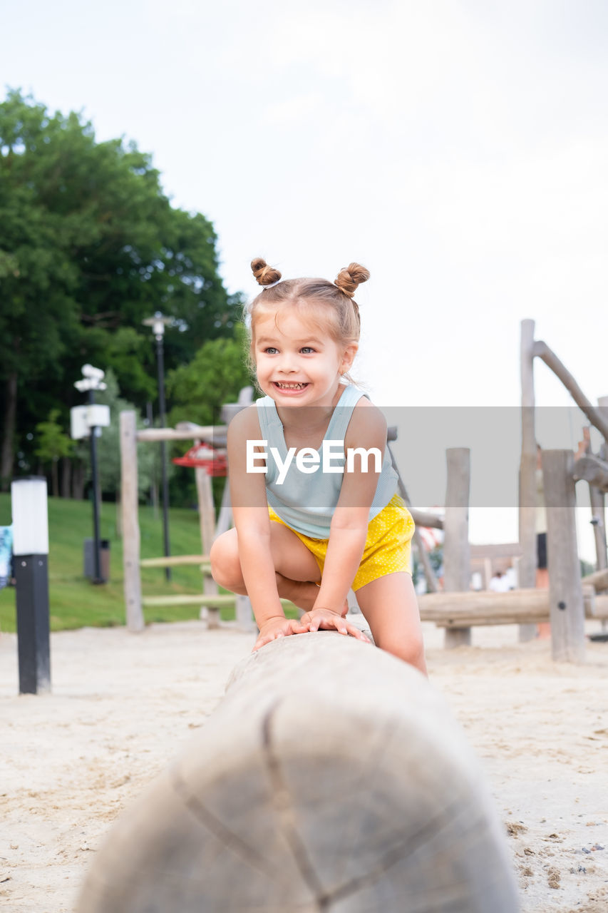 childhood, child, smiling, happiness, one person, emotion, day, fun, women, leisure activity, person, sports, enjoyment, female, clothing, portrait, lifestyles, front view, nature, playground, cheerful, toddler, looking at camera, summer, outdoors, men, vitality, teeth, smile, vacation, spring