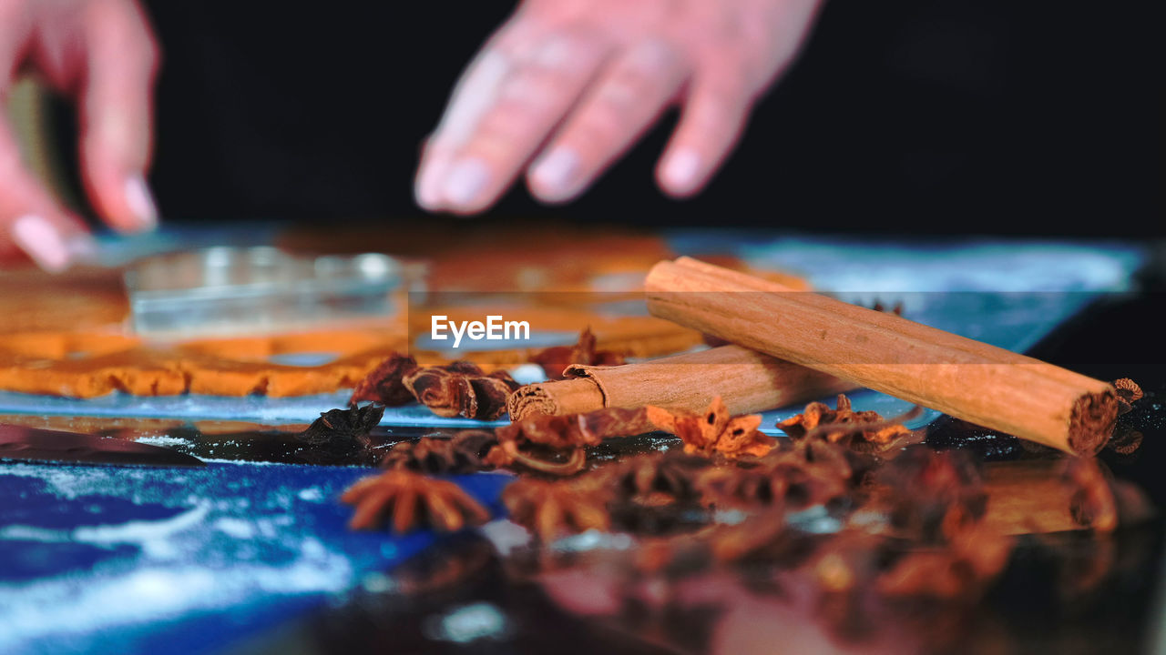 Cropped image of man holding toy blocks on table