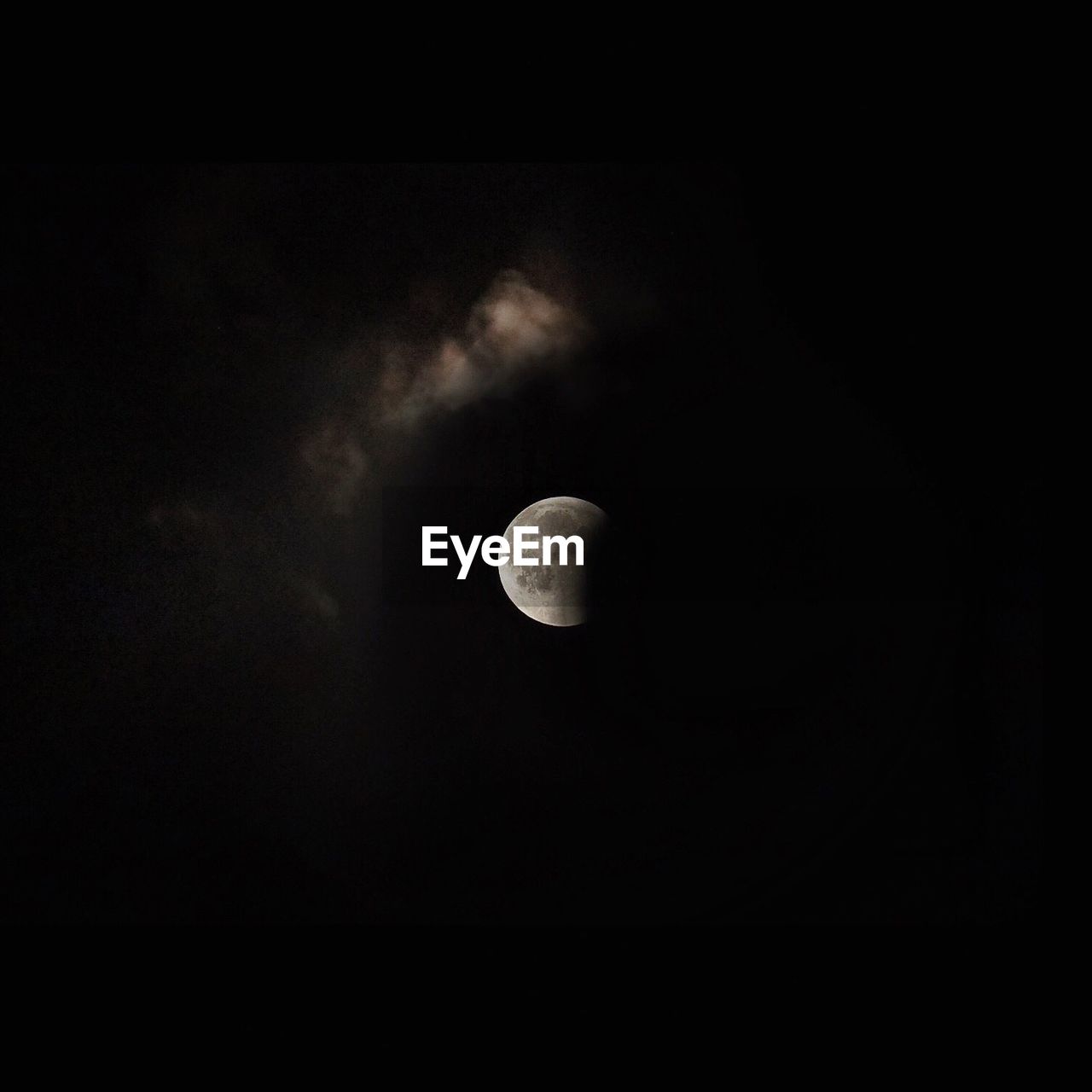 LOW ANGLE VIEW OF HALF MOON AGAINST SKY AT NIGHT