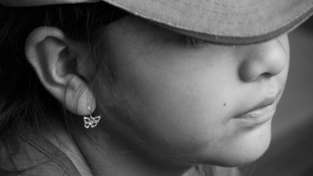 Cropped image of girl wearing cap