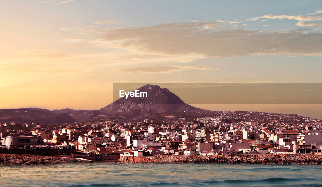 Heraklion city with a view of mount juktas known as sleeping zeus mountain at dawn, crete, greece