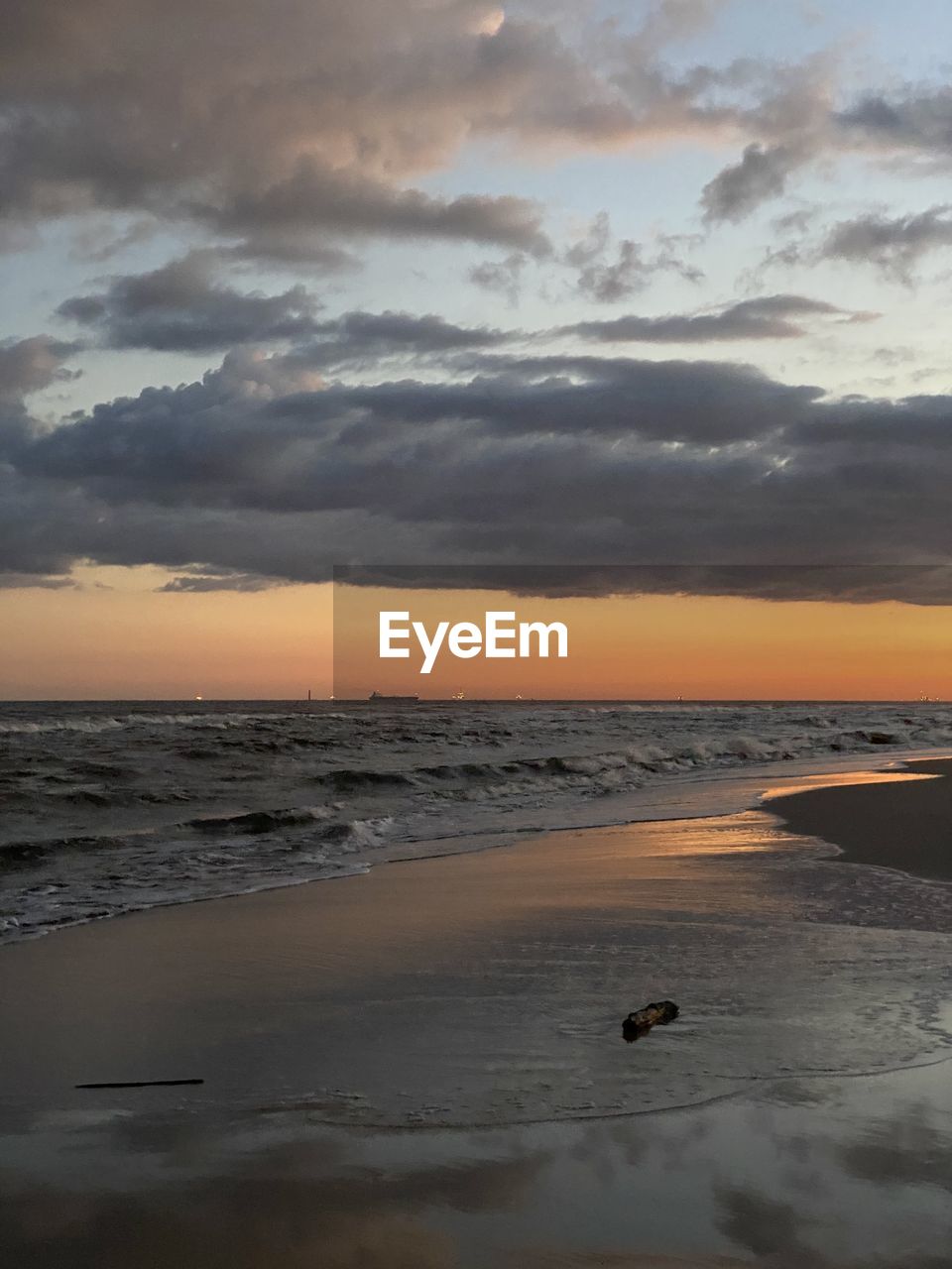 View of beach against sky during sunset