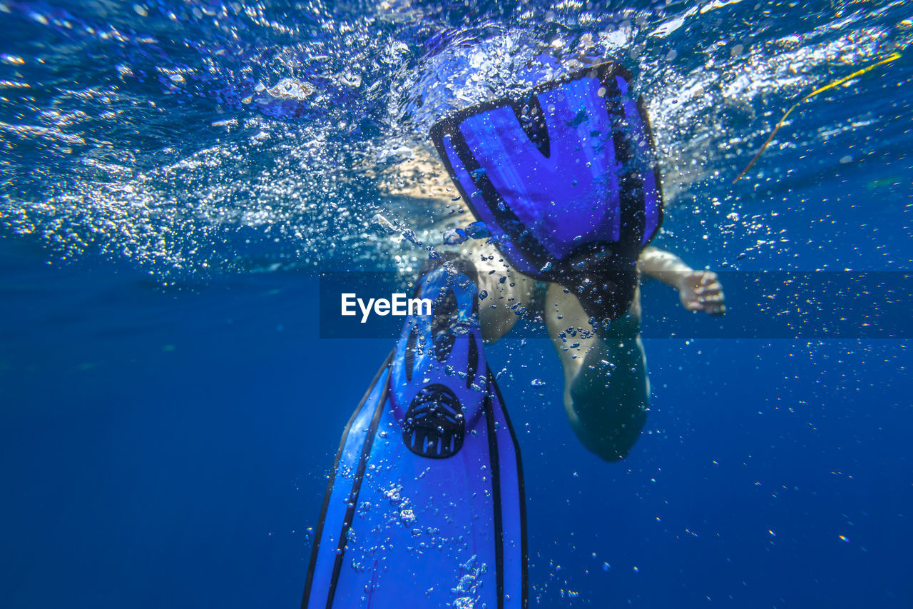 High angle view of man swimming in pool