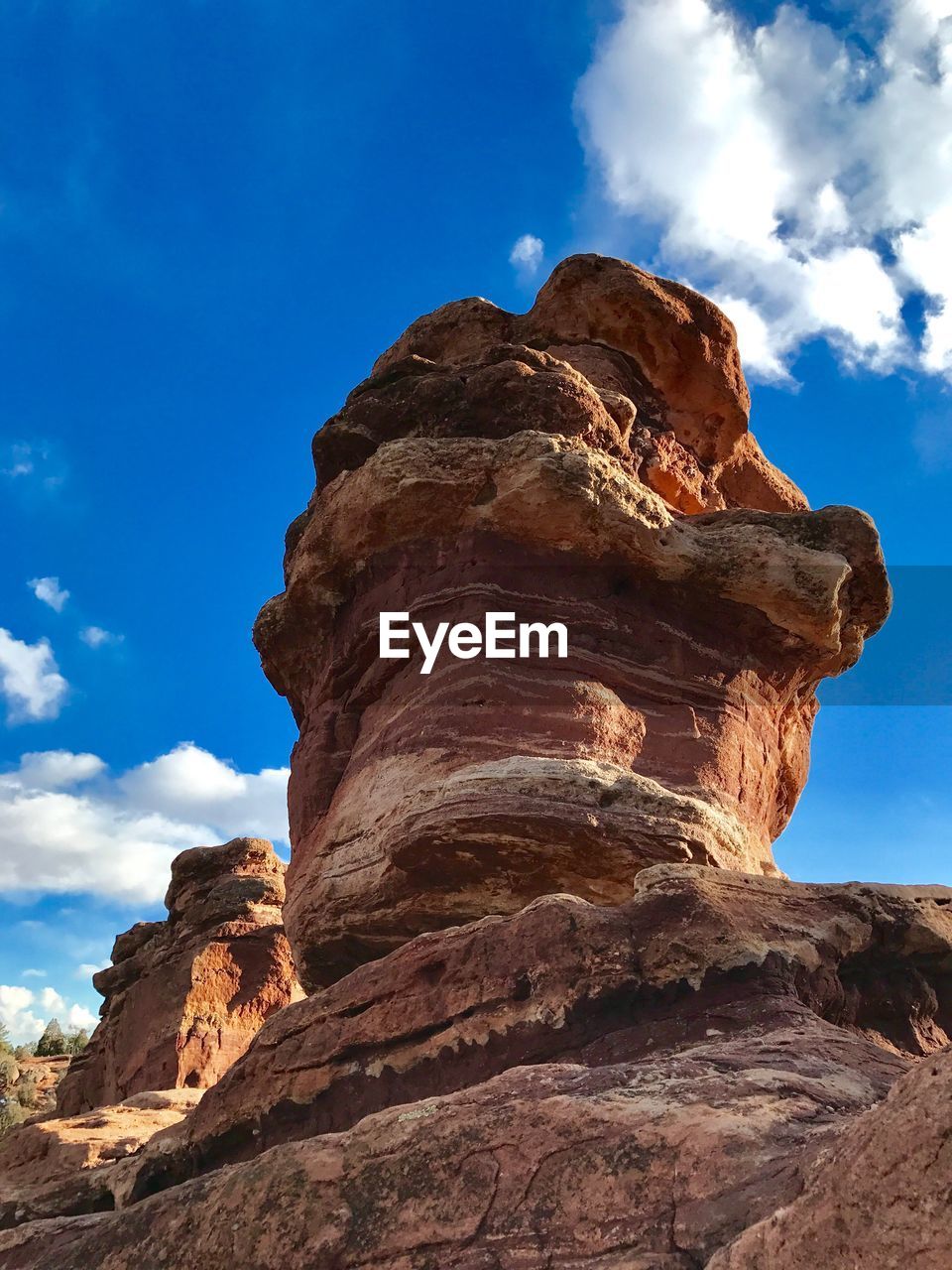 Low angle view of rock formation against sky