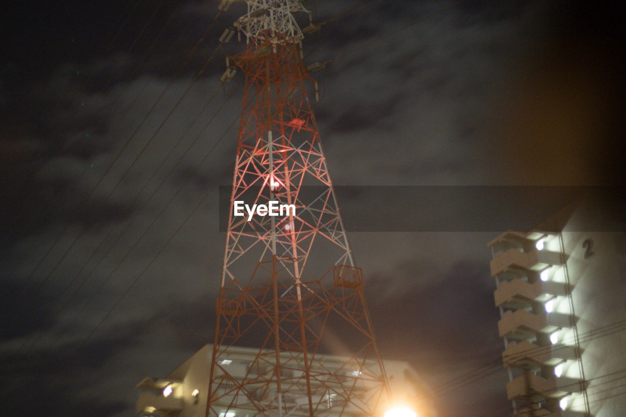 LOW ANGLE VIEW OF ILLUMINATED TOWER