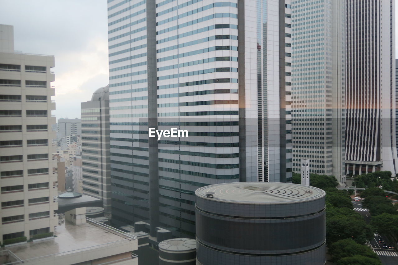 Modern buildings in city against sky