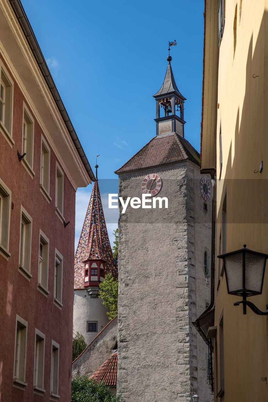 Low angle view of buildings against blue sky