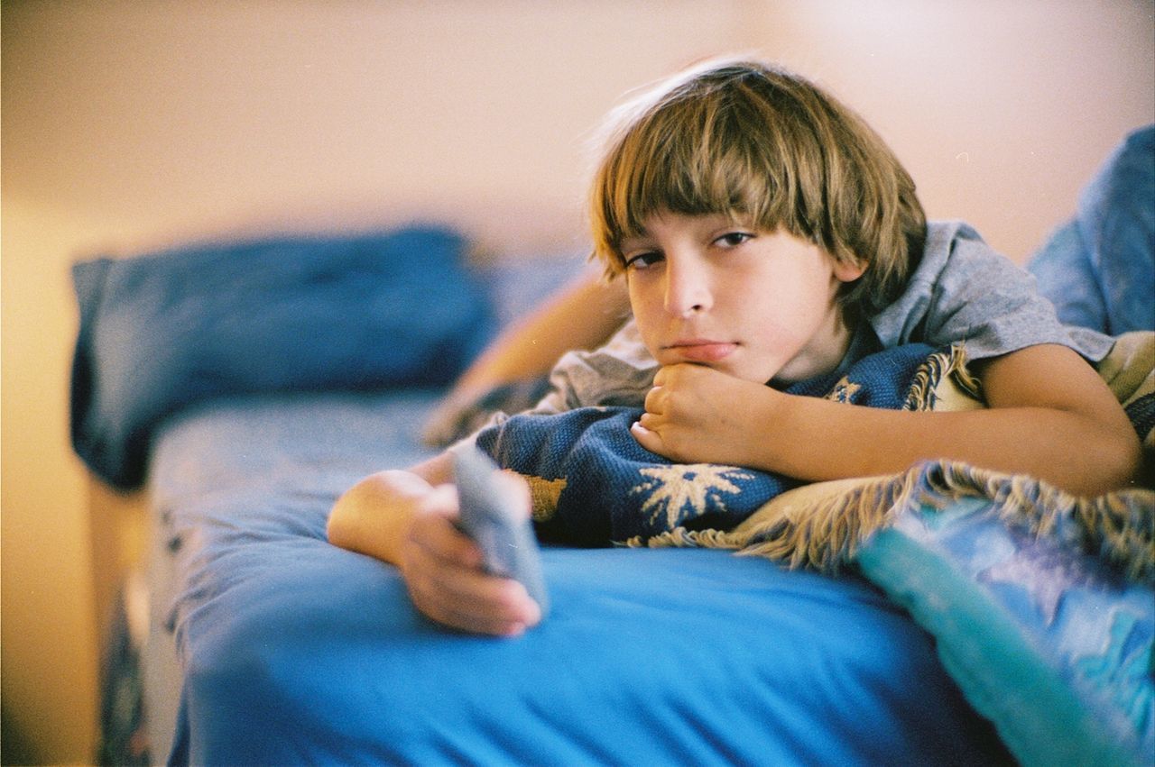 PORTRAIT OF CUTE GIRL ON SOFA