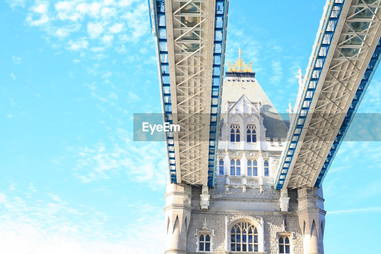 Low angle view of tower bridge against sky