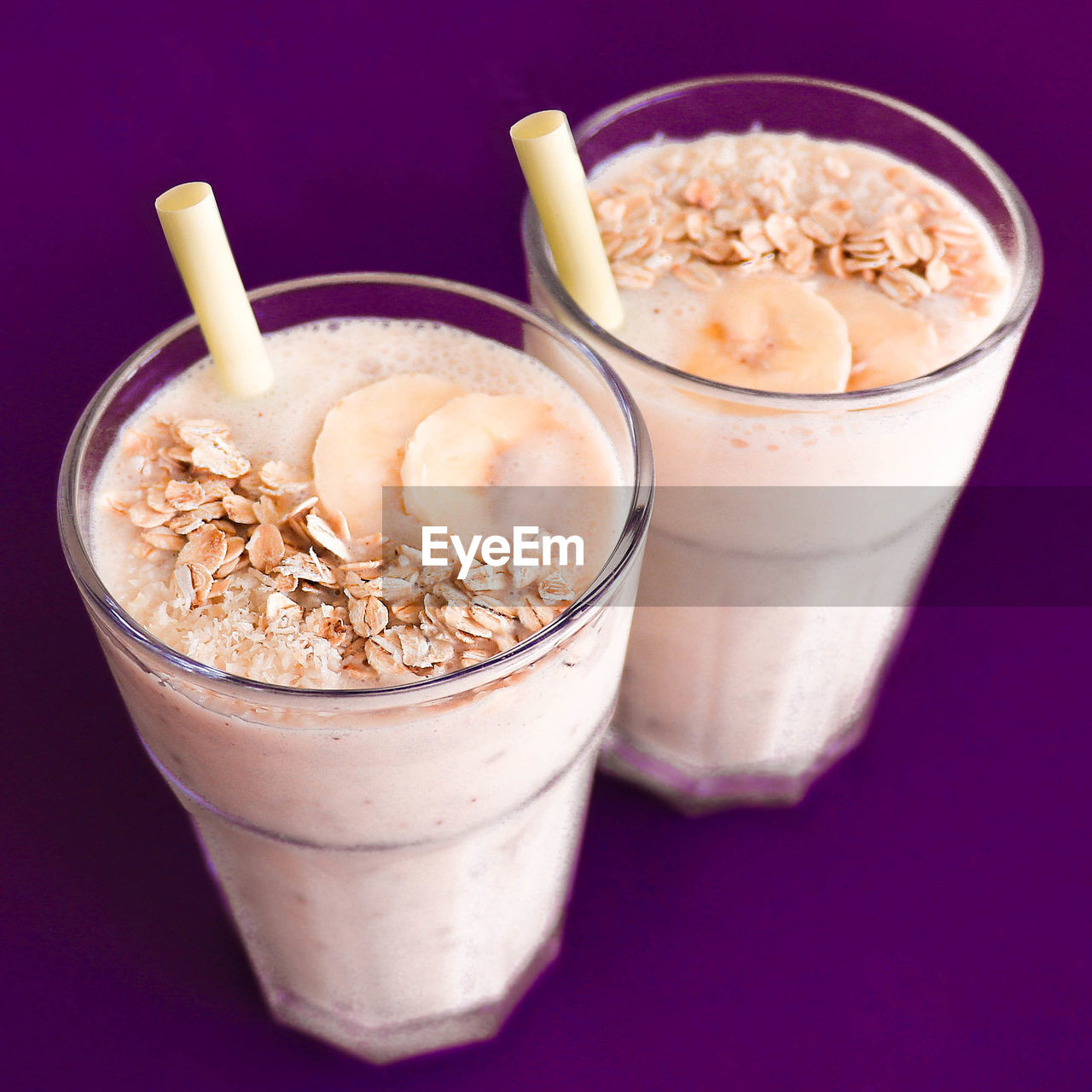 Banana smoothies with purple background
