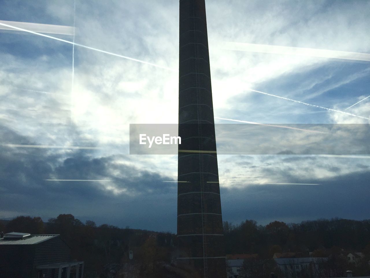 LOW ANGLE VIEW OF BUILDING AGAINST CLOUDS