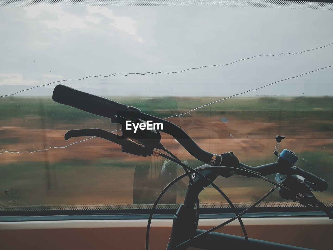 BICYCLE ON GLASS WINDOW