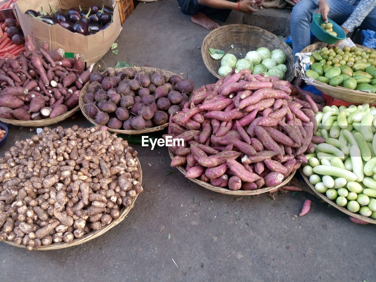 High angle view of vegetables in baskets at market for sale