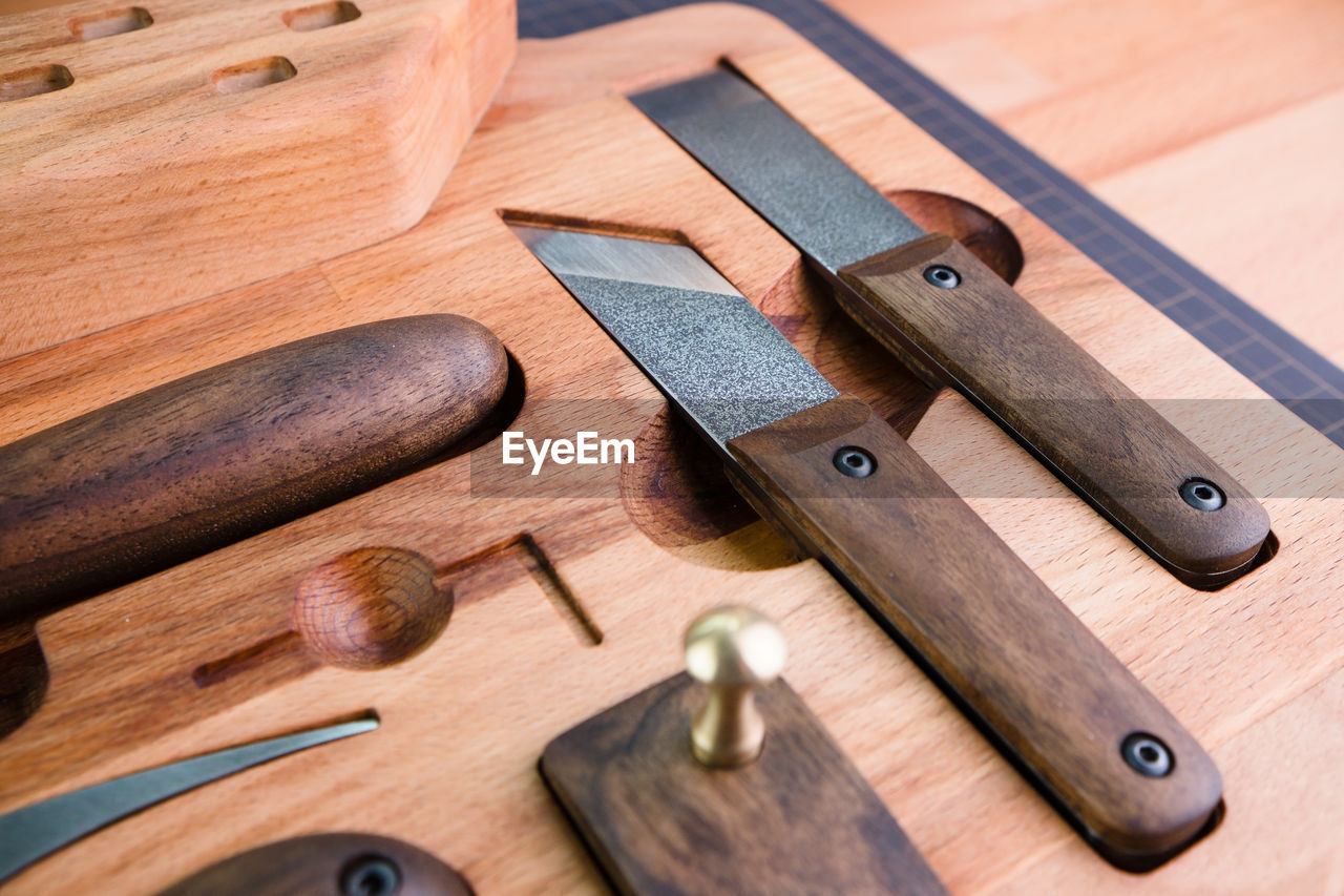 wood, cutting board, indoors, work tool, no people, high angle view, tool, close-up, table, knife, still life, brown