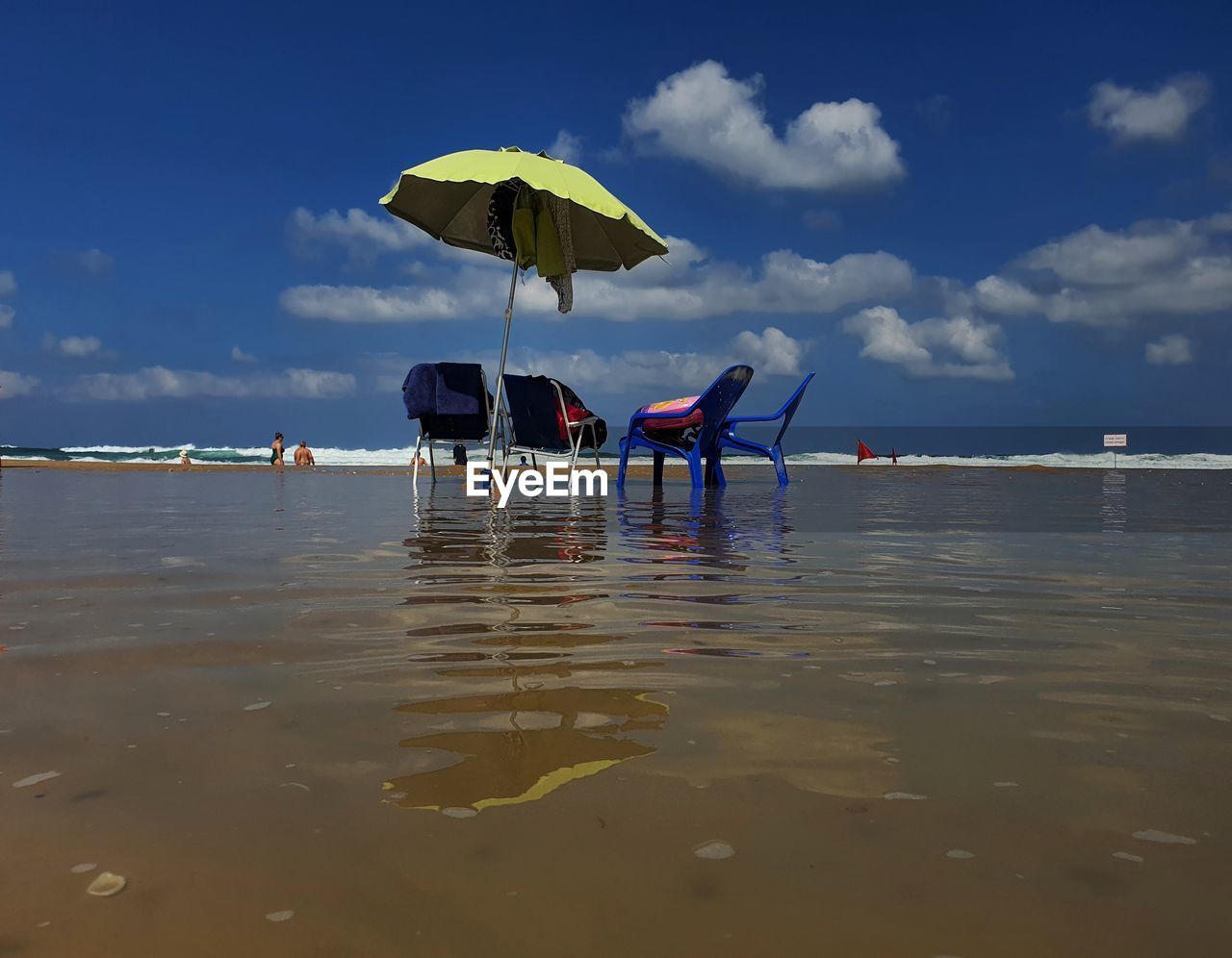 PEOPLE IN SEA AGAINST SKY