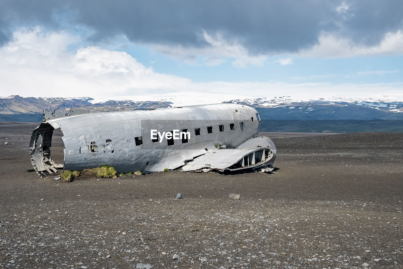 Abandoned military aircraft wreck at black sand beach in solheimasandur