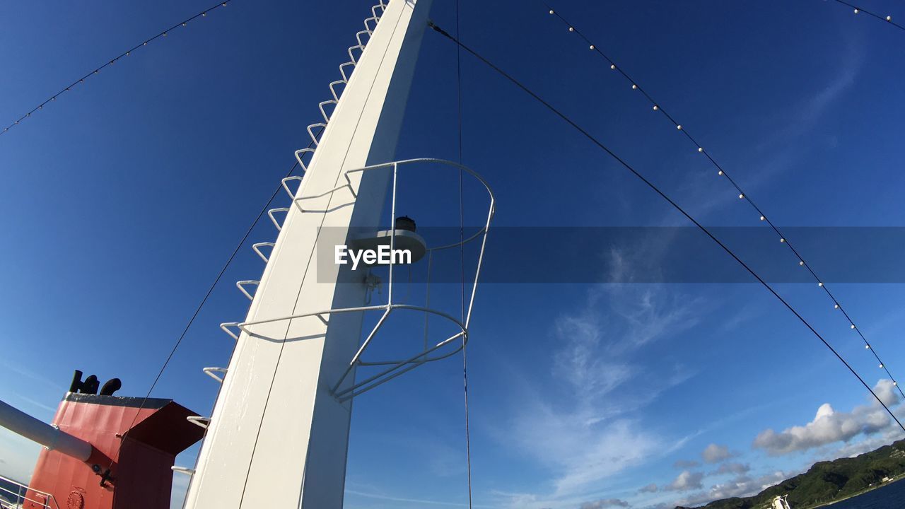 LOW ANGLE VIEW OF CABLES AGAINST SKY